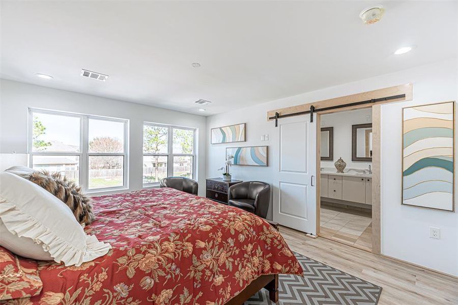 Primary Bedroom is large in size with an abundance of natural light