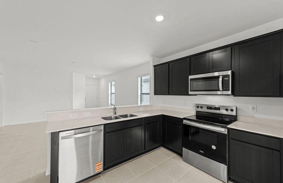 Furnished interior view inside a new home in Caloosa Cove, Labelle (Image 8).