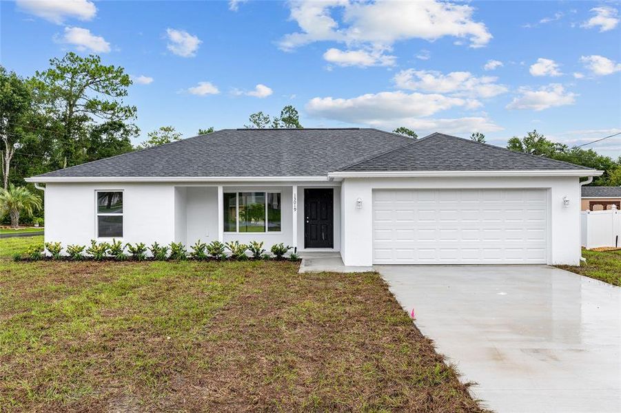 Front exterior of a new home in , Dunnellon, FL, highlighting curb appeal (Image 28).