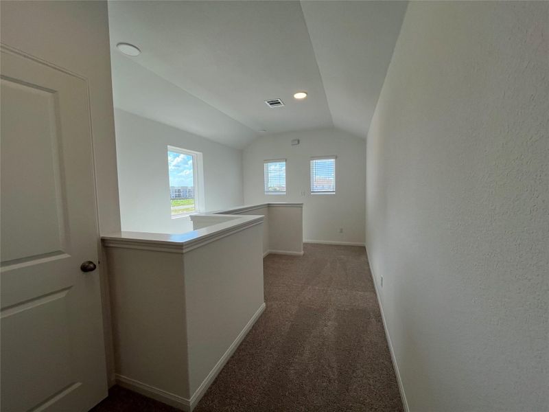 Large windows upstairs with tech center Large windows upstairs with tech center