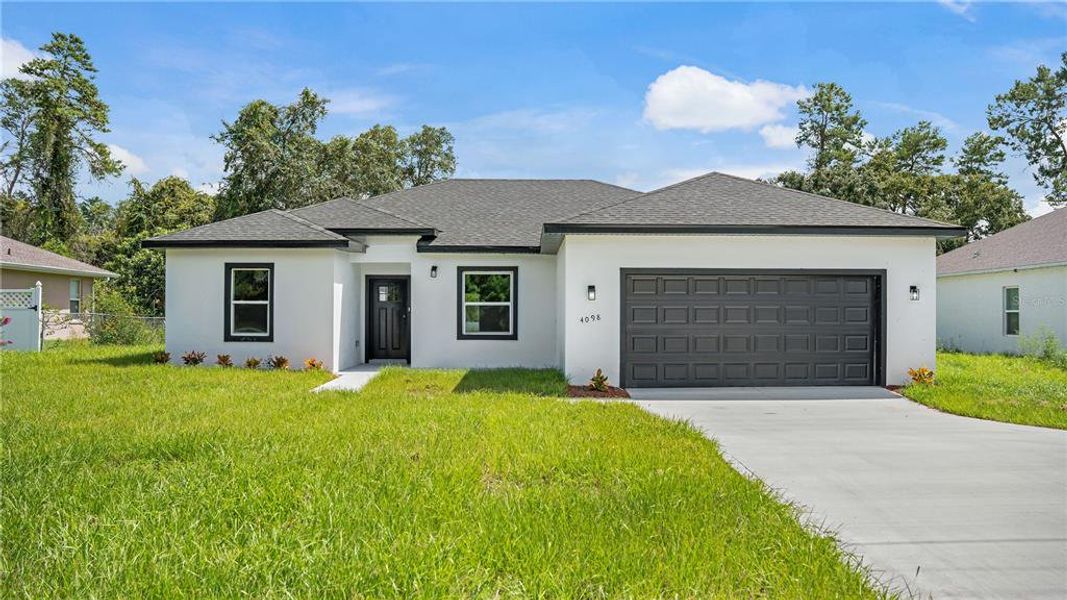 Front exterior of a new home in , Ocala, FL, highlighting curb appeal (Image 1). Front exterior of a new home in , Ocala, FL, highlighting curb appeal (Image 1).