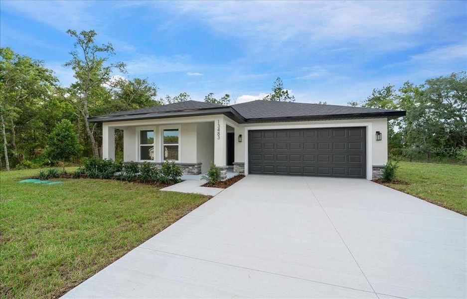 Front exterior of a new home in , Brooksville, FL, highlighting curb appeal (Image 28). Front exterior of a new home in , Brooksville, FL, highlighting curb appeal (Image 28).