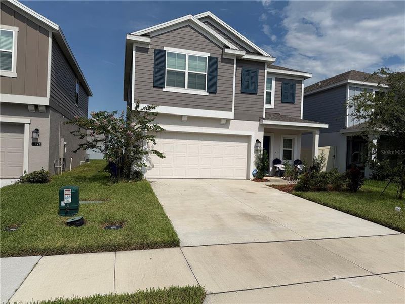 Front exterior of a new home in , Winter Haven, FL, highlighting curb appeal (Image 20).