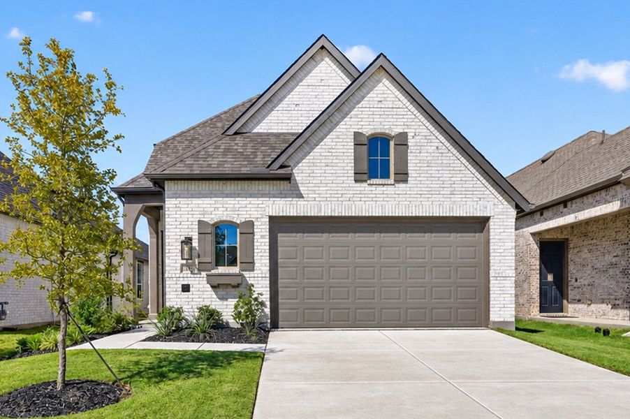 Front exterior of a new home in Creekshaw, Royse City, TX, highlighting curb appeal (Image 1). Front exterior of a new home in Creekshaw, Royse City, TX, highlighting curb appeal (Image 1).