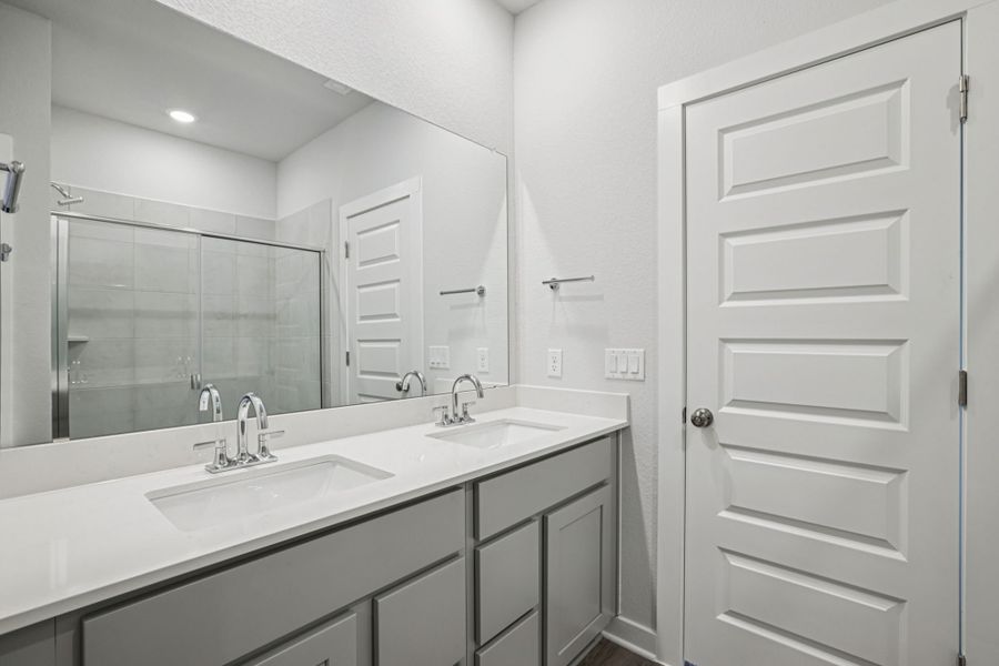 A bathroom with a glass shower.