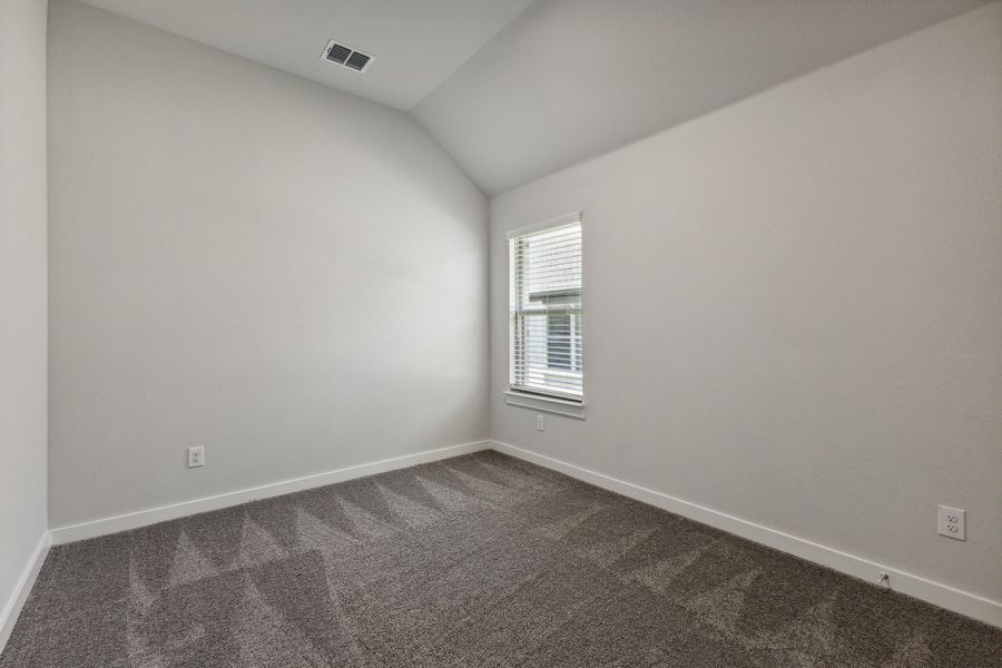 Bedroom in the Quartz home plan by Trophy Signature Homes – REPRESENTATIVE PHOTO