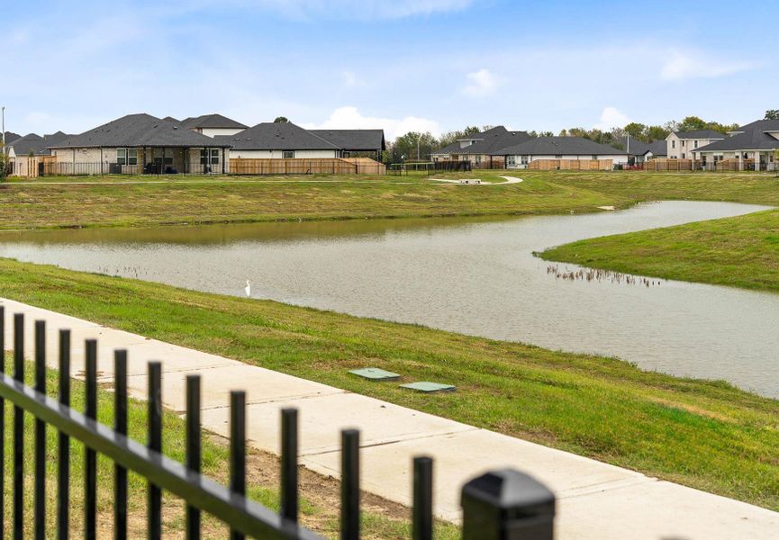 View of the water feature in Laurel Landing and from the backyard space of 211 Orchard Laurel Drive. View of the water feature in Laurel Landing and from the backyard space of 211 Orchard Laurel Drive.