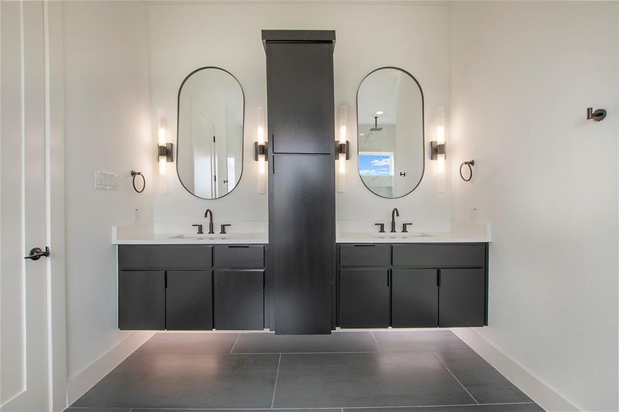 Bathroom featuring vanity and tile patterned floors