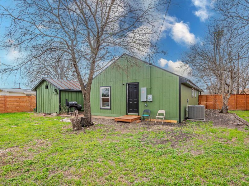 View of outbuilding with a fenced backyard