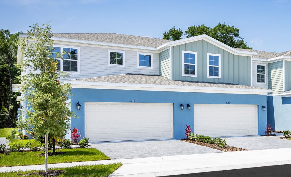 Representative exterior photo of a completed home built from the Elm by Hartizen Homes in Terra Haven, St. Cloud, FL (Image 1).