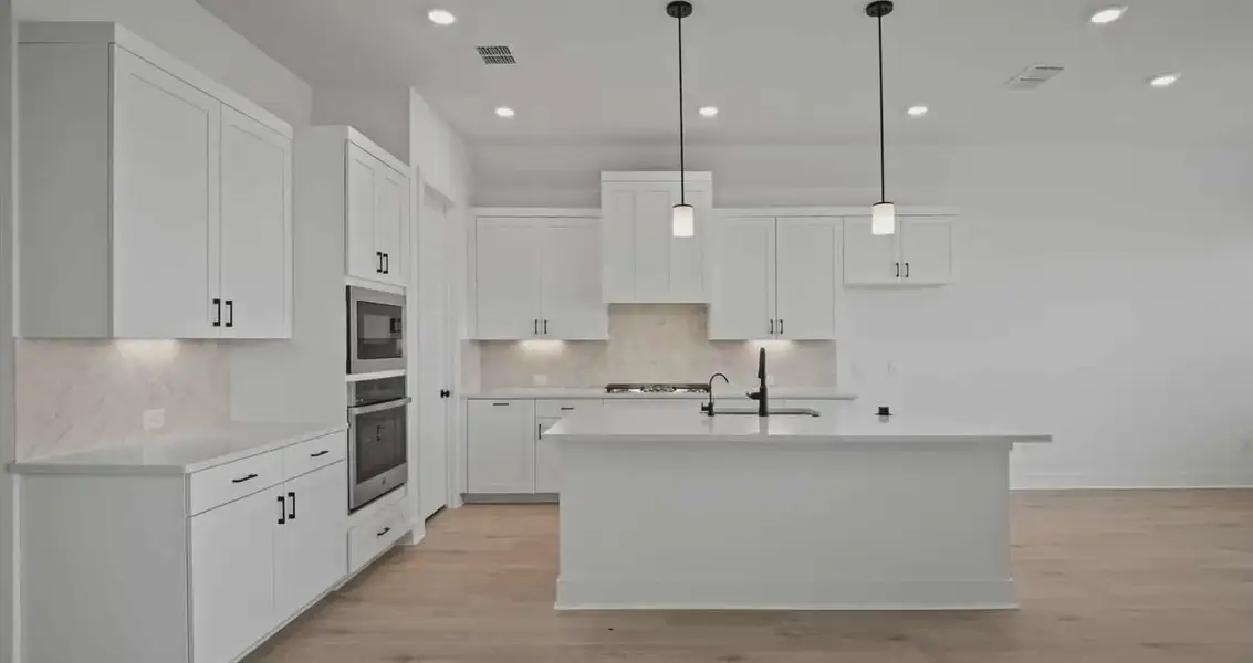 Representative furnished interior of a home built from the Farris by Chesmar Homes in Gregg Ranch, Marble Falls (Image 6).
