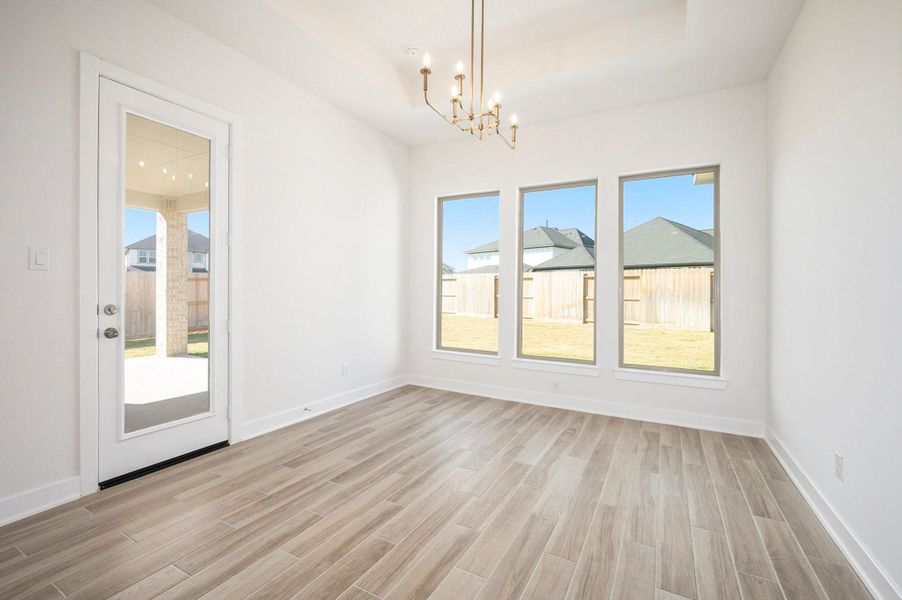 The primary suite offers a true retreat with two large walk-in closets and a luxurious ensuite bath.