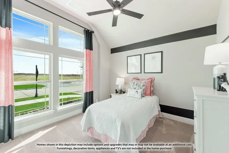Bedroom with vaulted ceiling, ceiling fan, large windows, and carpet flooring with pink accent curtains and decor Bedroom with vaulted ceiling, ceiling fan, large windows, and carpet flooring with pink accent curtains and decor