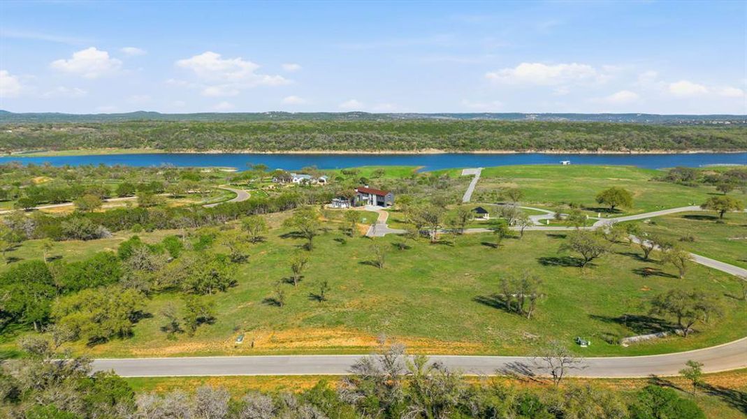 A sprawling lakeside estate with vast green spaces and scenic water views.