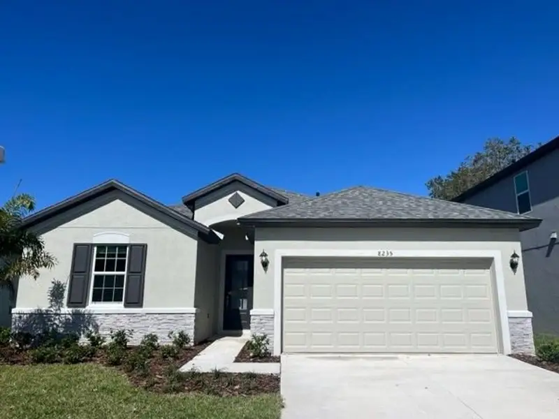 Front exterior of a new home in Southern Hills Plantation, Brooksville, FL, highlighting curb appeal (Image 2). Front exterior of a new home in Southern Hills Plantation, Brooksville, FL, highlighting curb appeal (Image 2).