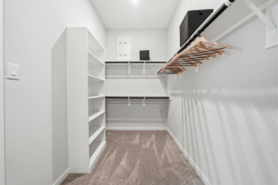 A white room with a white wall and a wood floor. A white room with a white wall and a wood floor.