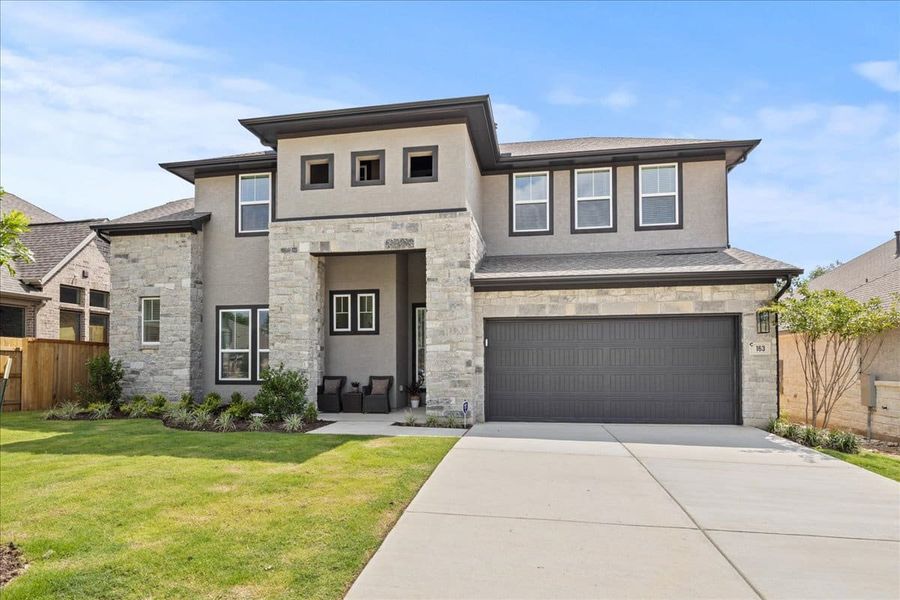Front exterior of a new home in 6 Creeks, Kyle, TX, highlighting curb appeal (Image 22).