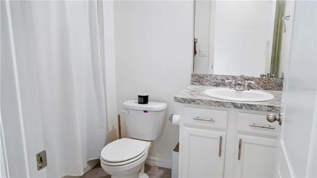 Furnished interior view inside a new home in Charles Cove Express, Davenport (Image 17).