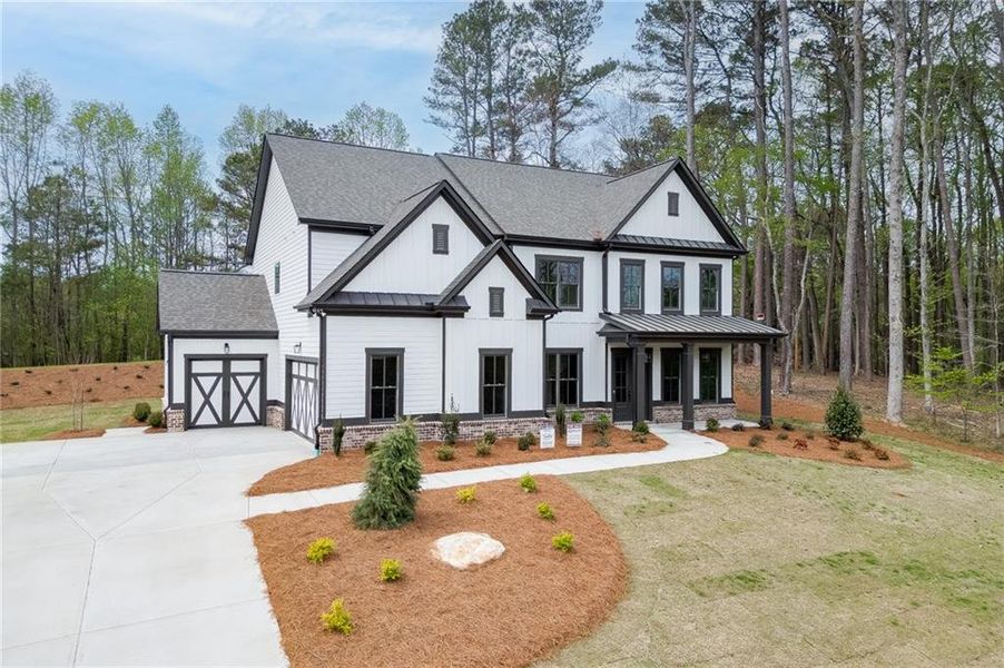 Front exterior of a new home in , Cumming, GA, highlighting curb appeal (Image 2). Front exterior of a new home in , Cumming, GA, highlighting curb appeal (Image 2).