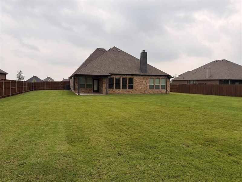 Exterior details and patio area of a home in Coyote Crossing, Godley (Image 25).