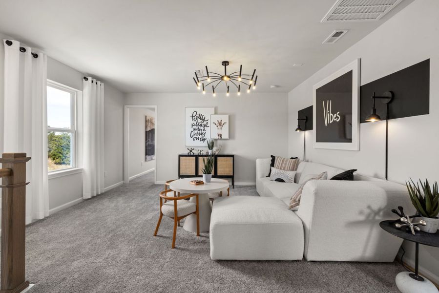 Furnished interior view inside a new home in Huxley, Apex (Image 17). Furnished interior view inside a new home in Huxley, Apex (Image 17).