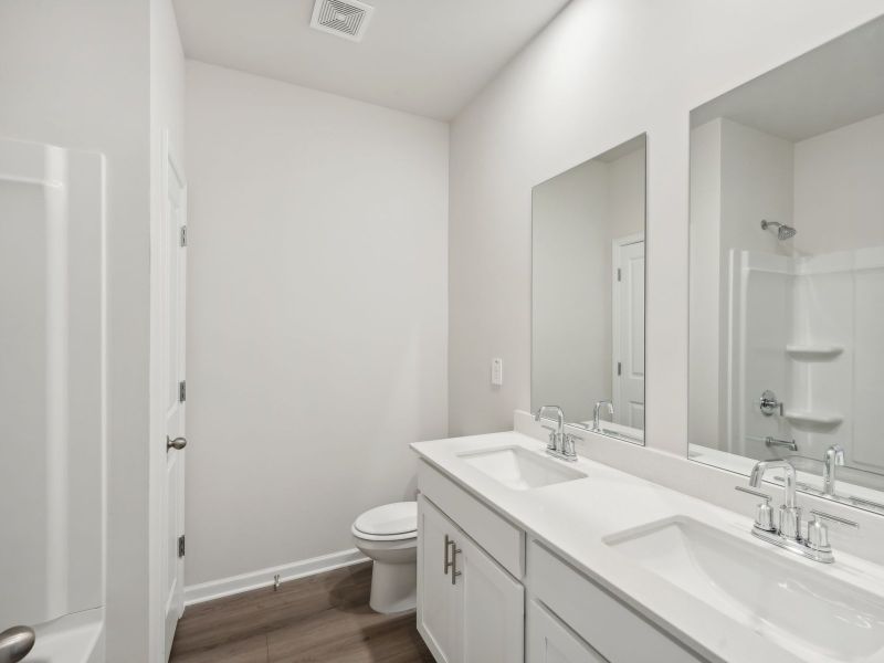 Furnished interior view inside a new home in Martin Springs - Estate Series, Lawrenceville (Image 12).