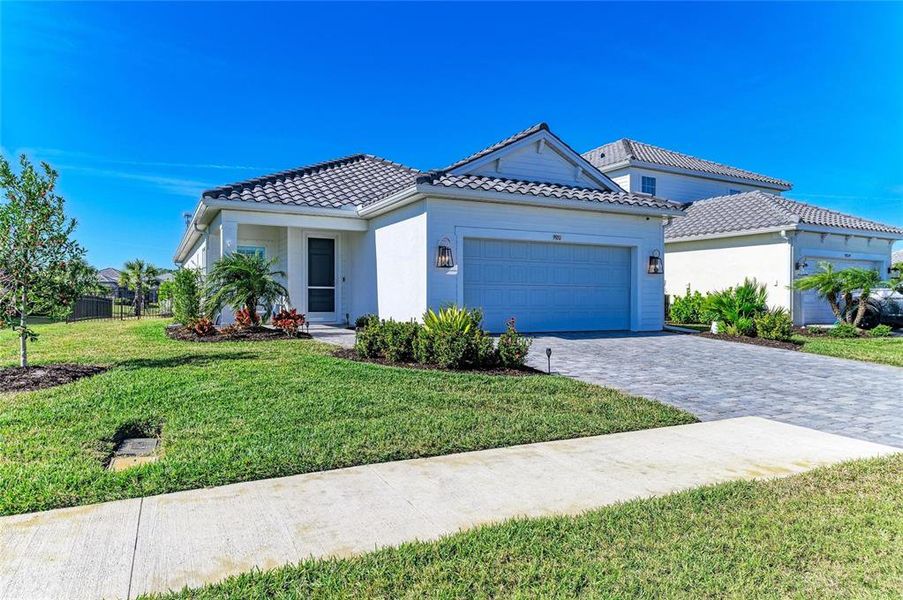 Front exterior of a new home in , Sarasota, FL, highlighting curb appeal (Image 1). Front exterior of a new home in , Sarasota, FL, highlighting curb appeal (Image 1).