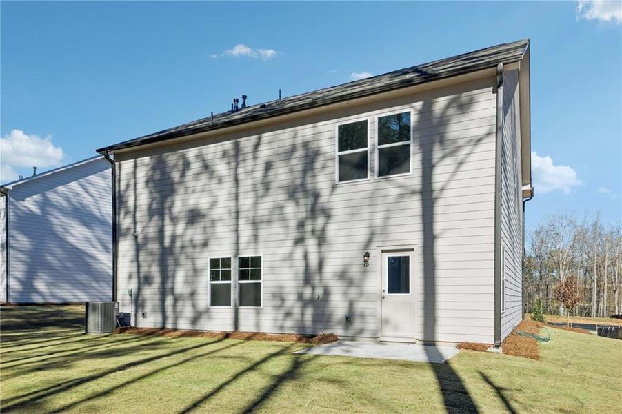 Exterior details and patio area of a home in The Pointe at Heron Bay, Locust Grove (Image 22).