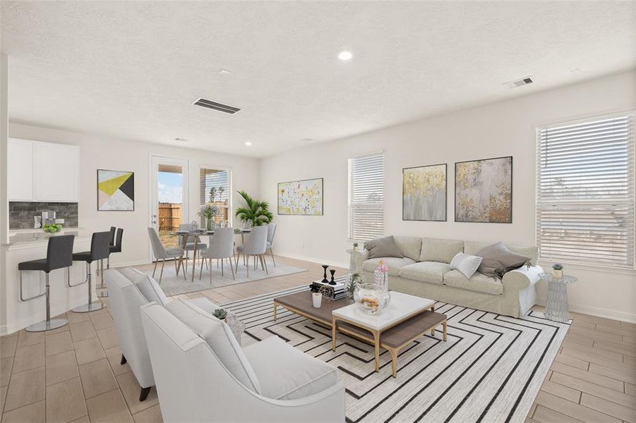 Gather the family and guests together in your lovely living room! Featuring high ceilings, recessed lighting, custom paint, gorgeous floors and large windows that provide plenty of natural lighting throughout the day.