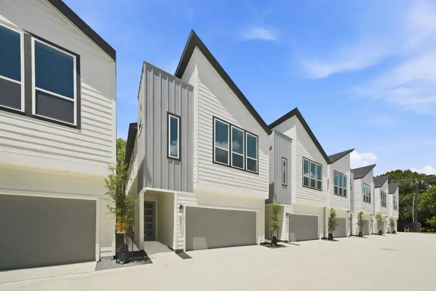 Attractive contemporary community showcasing modern architecture, private two-car garages, and a clean, cohesive streetscape. Attractive contemporary community showcasing modern architecture, private two-car garages, and a clean, cohesive streetscape.