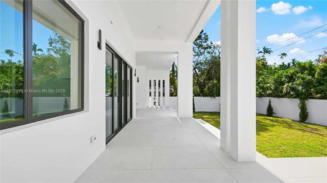 Exterior details and patio area of a home in , Miami Springs (Image 19).