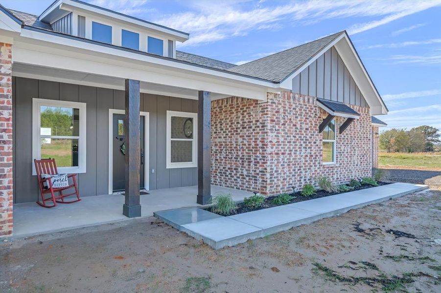 Fabulous front porch for enjoying the peace and quiet and pine tree views!