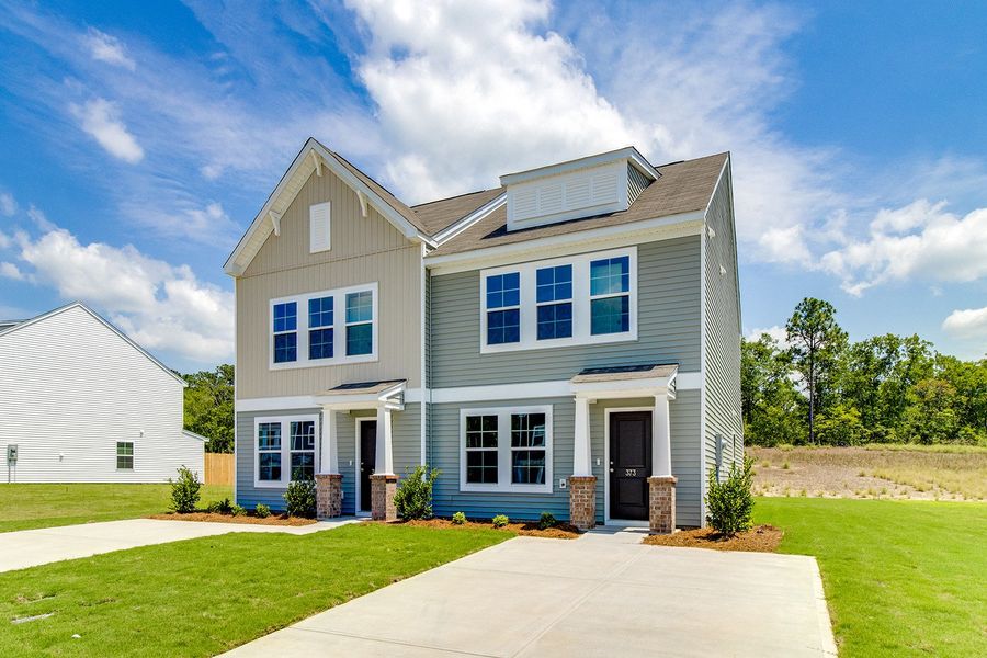 Front exterior of a new home in Padgett Commons, Hopkins, SC, highlighting curb appeal (Image 1). Front exterior of a new home in Padgett Commons, Hopkins, SC, highlighting curb appeal (Image 1).