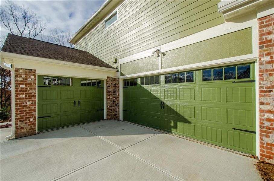 Front exterior of a new home in , Ball Ground, GA, highlighting curb appeal (Image 1).