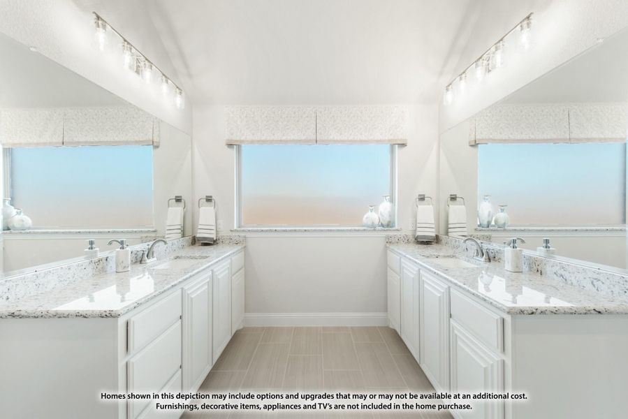 Dual-sink master bathroom with white cabinets, granite countertops, and large windows on opposite walls Dual-sink master bathroom with white cabinets, granite countertops, and large windows on opposite walls