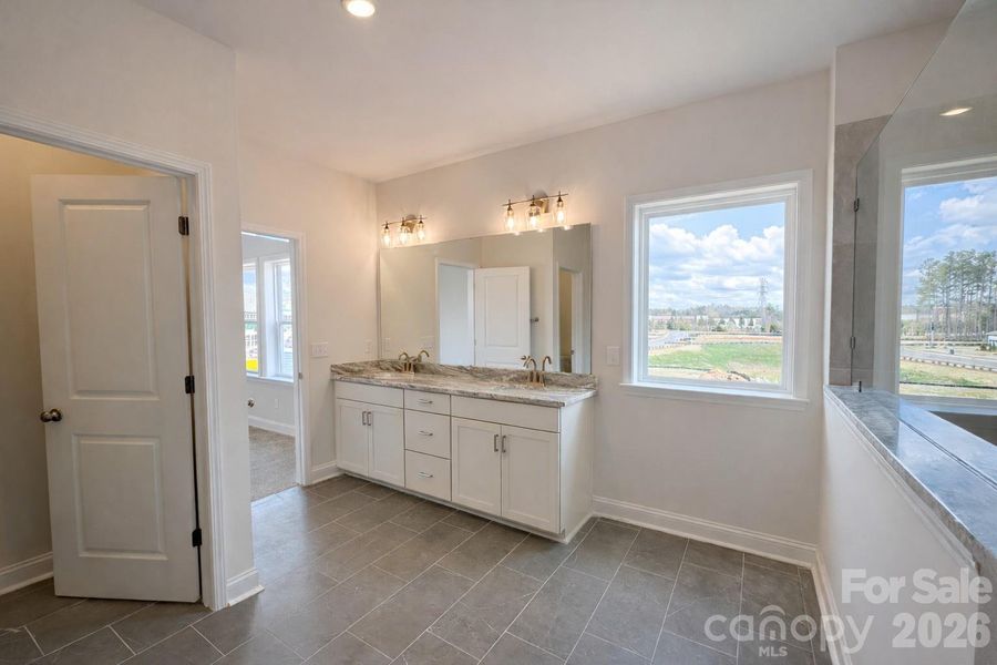 Owner's Bath with Tons of Natural Light
