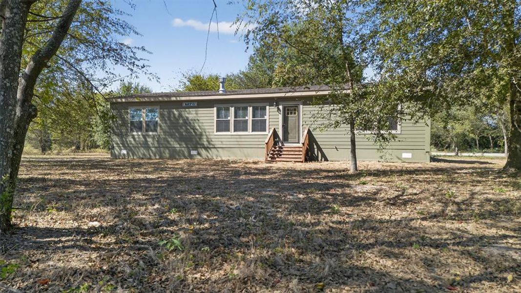 View of front facade with entry steps and crawl space View of front facade with entry steps and crawl space