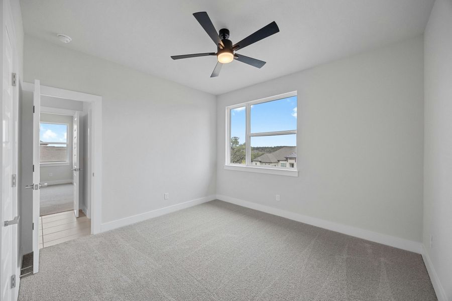 Spacious, unfurnished interior of a new home in Caliterra, Dripping Springs (Image 33).