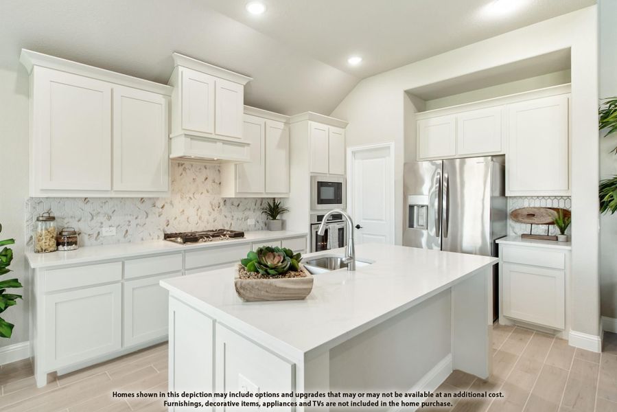 Kitchen with white cabinets, center island with sink, stainless steel appliances, and decorative tile backsplash Kitchen with white cabinets, center island with sink, stainless steel appliances, and decorative tile backsplash