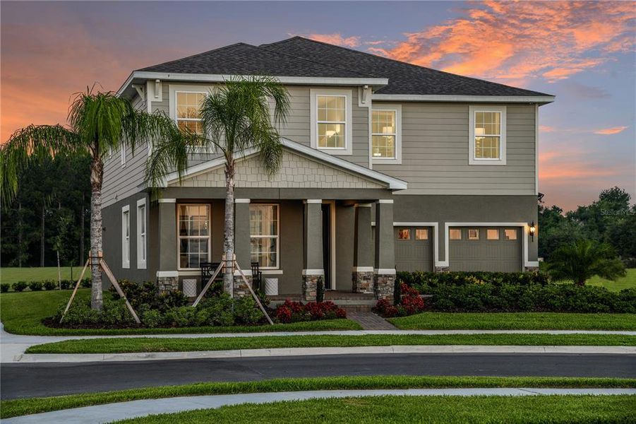 Front exterior of a new home in The Palms at Venetian Bay, New Smyrna Beach, FL, highlighting curb appeal (Image 1).