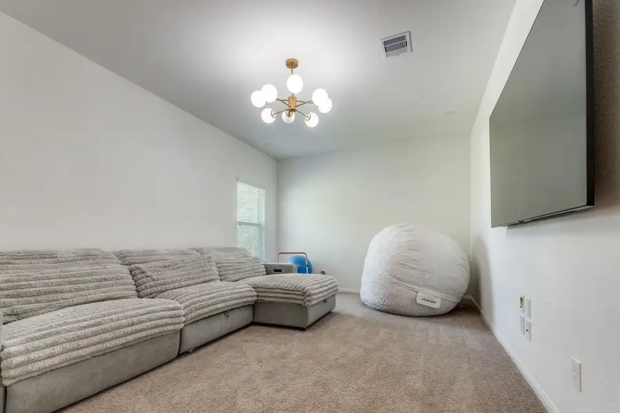 Furnished interior view inside a new home in Deer Pines, Conroe (Image 10).