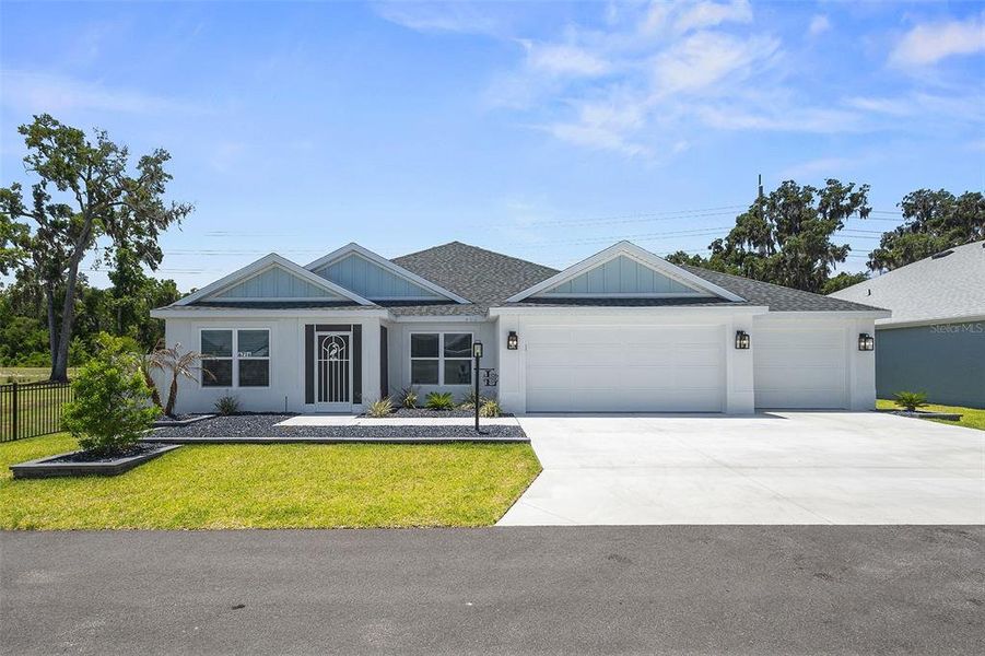 Front exterior of a new home in , The Villages, FL, highlighting curb appeal (Image 2).