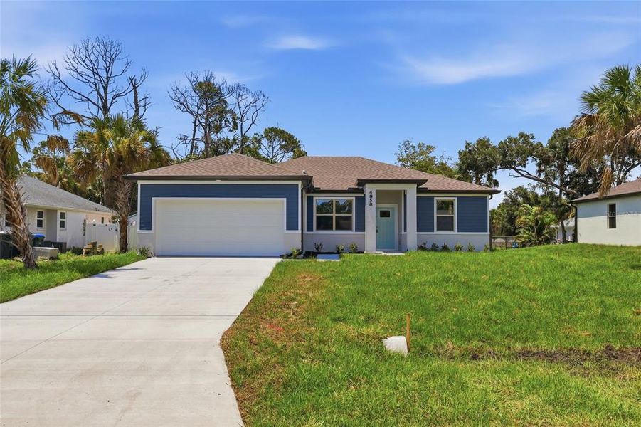 Front exterior of a new home in , North Port, FL, highlighting curb appeal (Image 23). Front exterior of a new home in , North Port, FL, highlighting curb appeal (Image 23).