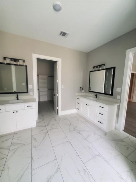 PRIMARY BATH LOOKING INTO THE PRIMARY CLOSET PRIMARY BATH LOOKING INTO THE PRIMARY CLOSET