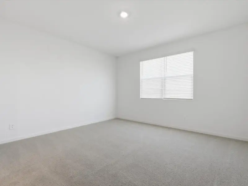 Spacious, unfurnished interior of a new home in Rancho Mirage Estate Series, Maricopa (Image 12).