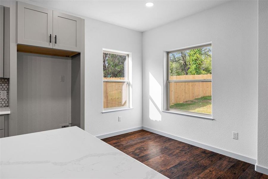 Unfurnished bedroom with dark wood-style flooring and recessed lighting