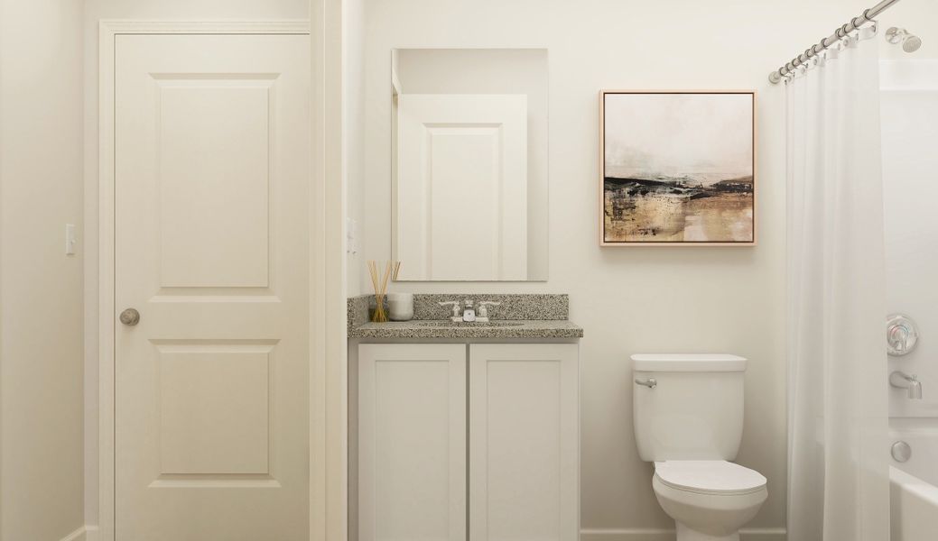 A bathroom with a toilet and sink.