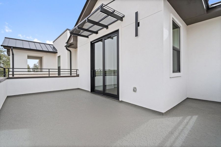 Exterior details and patio area of a home in Milky Way at River Place, Austin (Image 9).