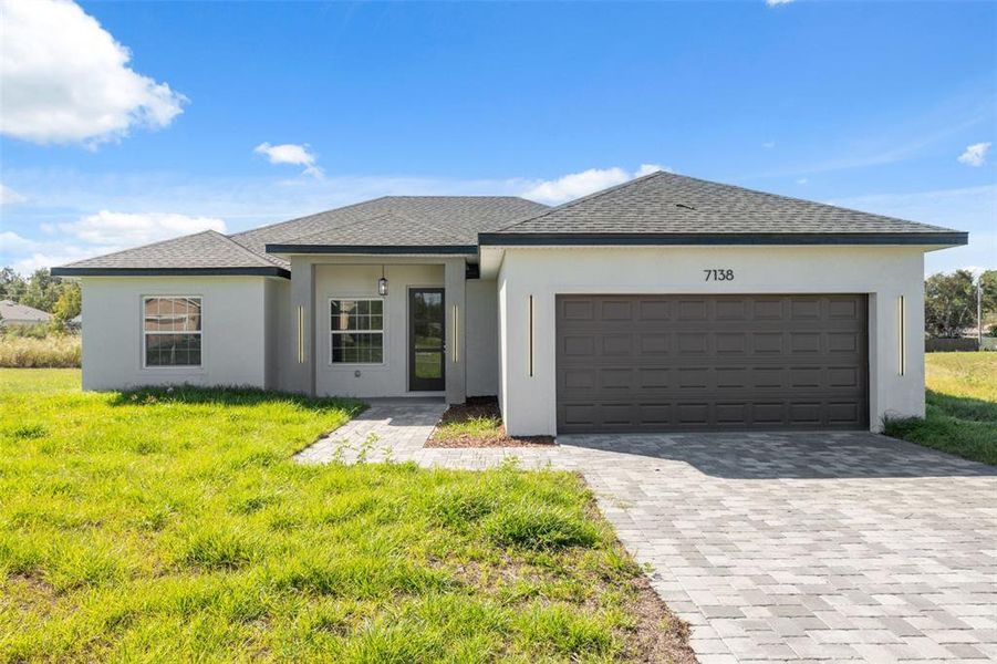 Front exterior of a new home in , Ocala, FL, highlighting curb appeal (Image 20).
