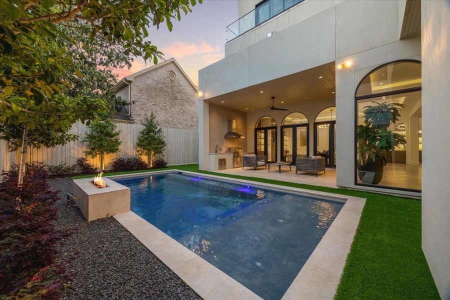 Exquisite pool and fire pit creating a spectacular outdoor setting